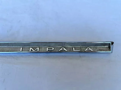 USED ORIGINAL GM 1964 CHEVROLET IMPALA GLOVE BOX DOOR EMBLEM CHROME TRIM MOLDING
